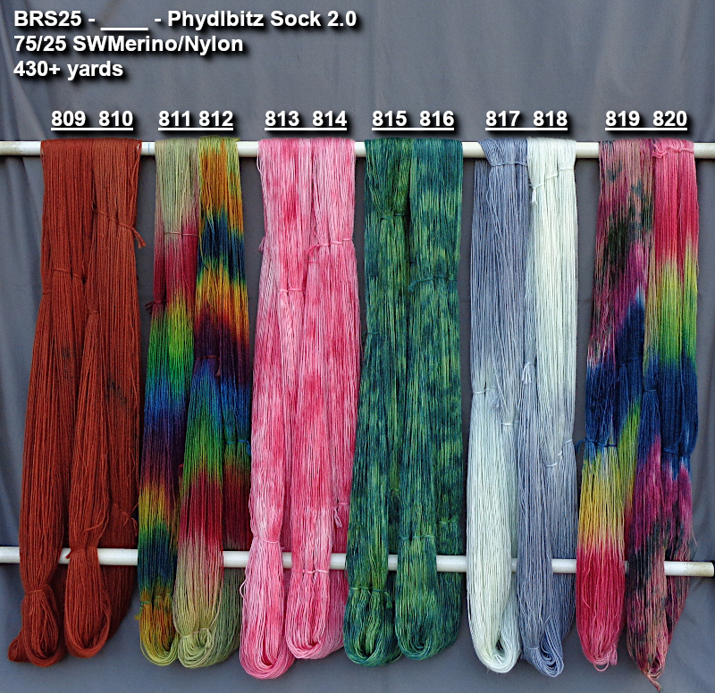 Photo of multi-color hand-dyed yarns drying.
