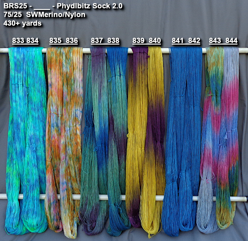 Photo of hand-dyed yarns drying for previewing.