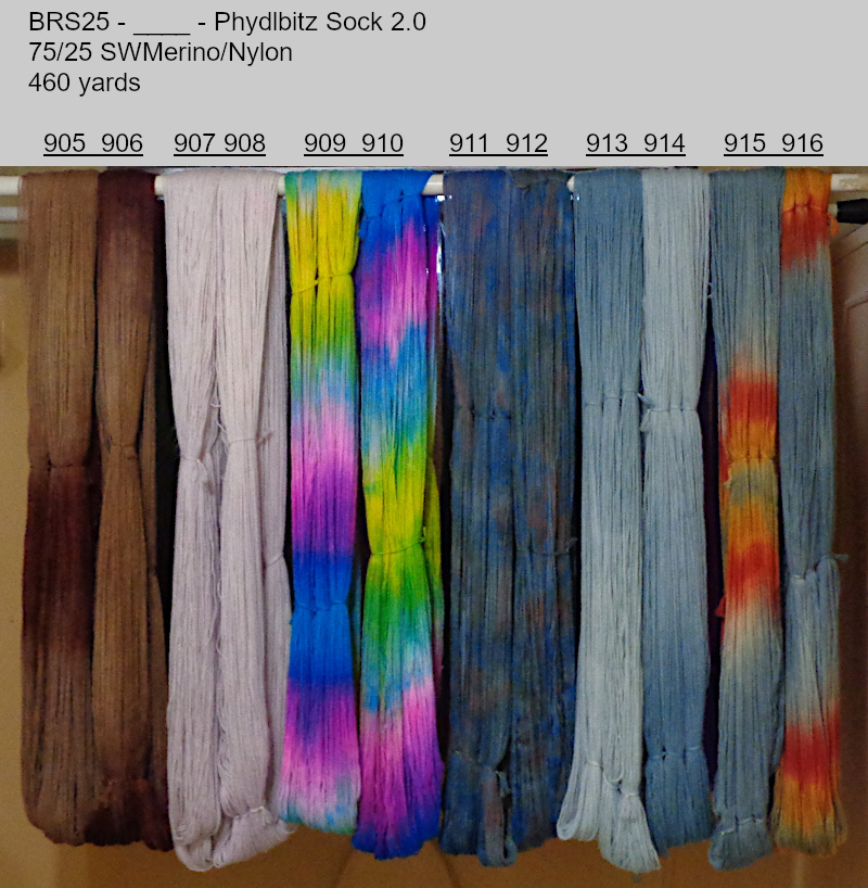 Picture of hand-dyed yarns drying on the rack.