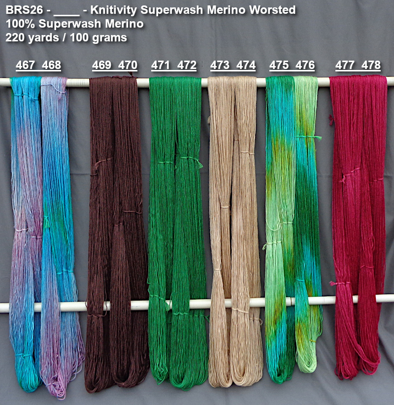 Photo of hand-dyed yarns drying on a rack for preview purchasing.