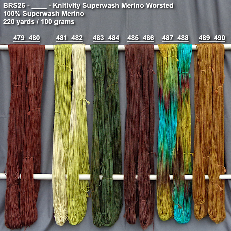 Photo of hand-dyed yarns drying on a rack for preview purchasing.
