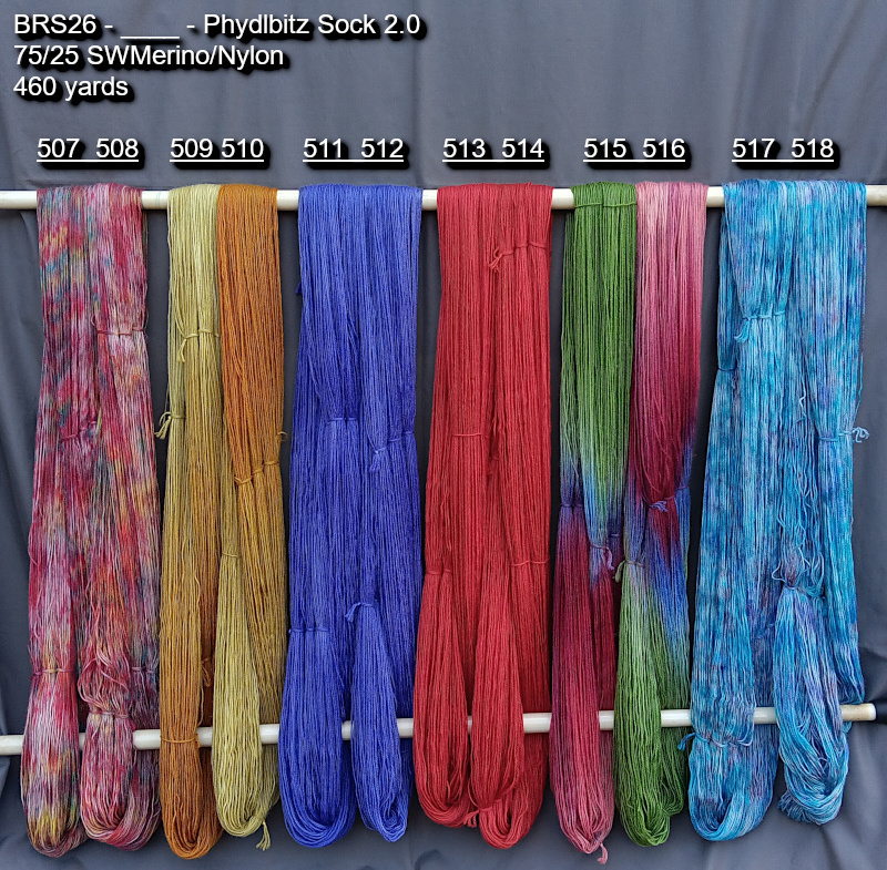 Picture of hand-dyed yarns drying on the rack